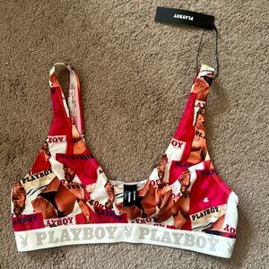 playboy sports bra in size L. Never worn but has dirt on the band around body.